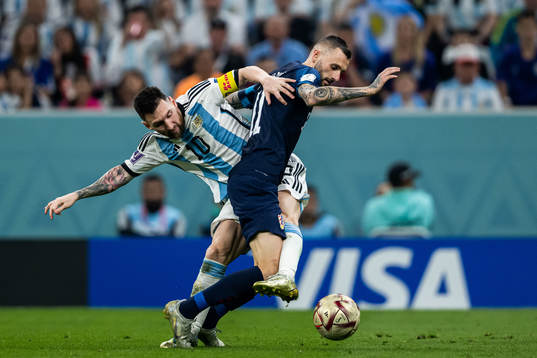 Lionel Messi of Argentina and Marcelo Brozovic of Croatia