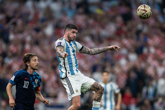 Luka Modric of Croatia and Rodrigo de Paul of Argentina