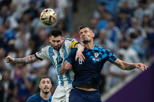 Lionel Messi of Argentina and Dejan Lovren of Croatia