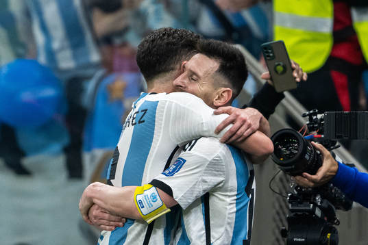 Julian Alvarez and Lionel Messi of Argentina celebrate the