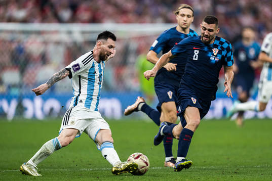 Lionel Messi of Argentina and Mateo Kovacic of Croatia