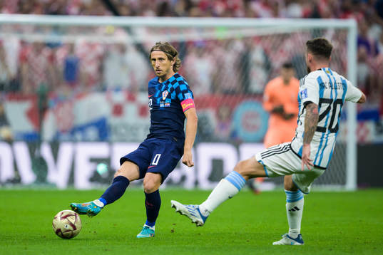 Luka Modric of Croatia and Alexis Mac Allister of Argentina