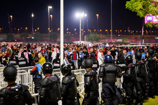 police with riot gear outside of the stadium