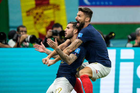 Theo Hernandez and Olivier Giroud of France celebrate