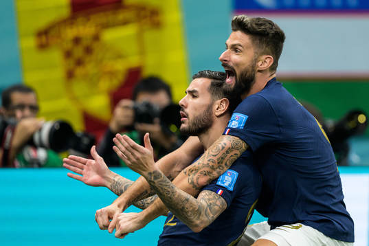 Theo Hernandez and Olivier Giroud of France celebrate