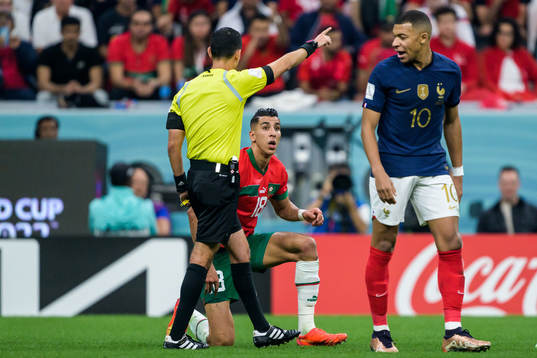 Jawad El Yamiq of Morocco in a discussion with Kylian