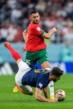 Selim Amallah of Morocco and Olivier Giroud of France