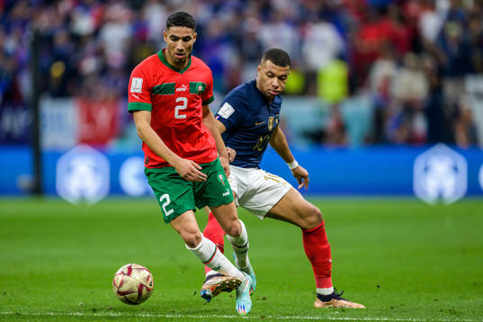Achraf Hakimi of Morocco and Kylian Mbappe of France
