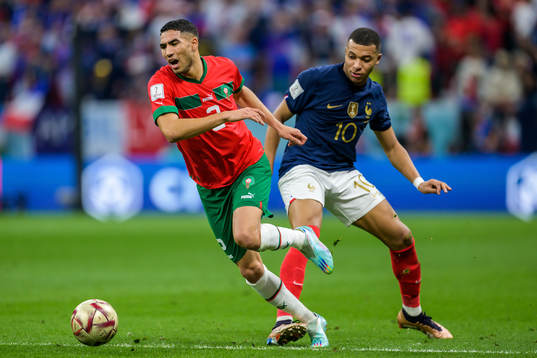 Achraf Hakimi of Morocco and Kylian Mbappe of France