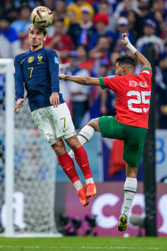Antoine Griezmann of France and Yahya Attiat-Allah of