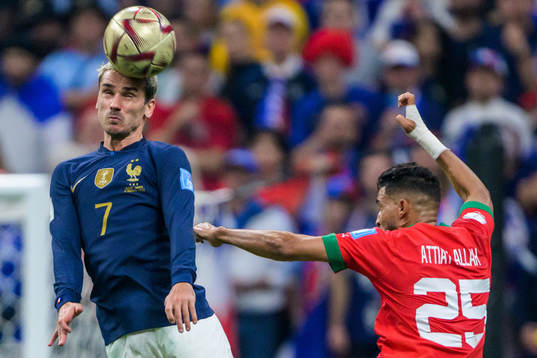 Antoine Griezmann of France and Yahya Attiat-Allah of