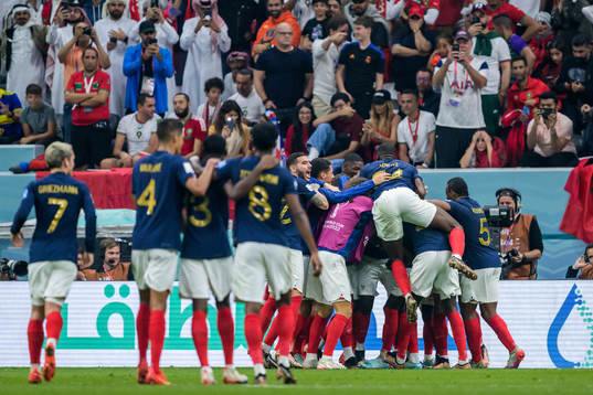 Players of France celebrate as Randal Kolo Muani has scored