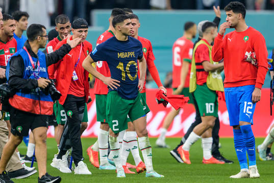 Achraf Hakimi of Morocco with Kylian Mbappe of France’s