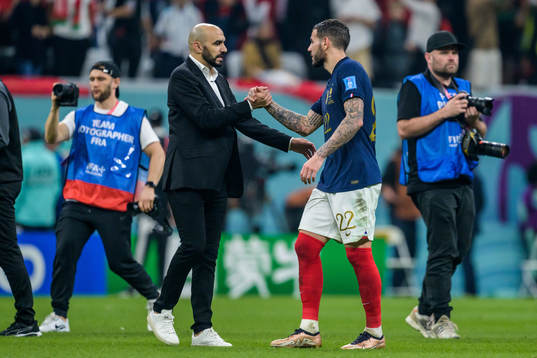 head coach Walid Regragui of Morocco and Theo Hernandez of