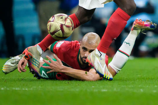 Sofyan Amrabat of Morocco reaches for the ball between the