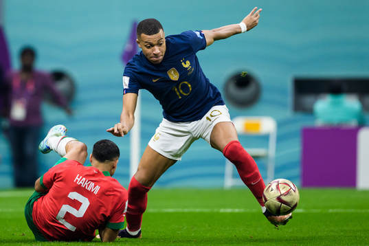 Achraf Hakimi of Morocco and Kylian Mbappe of France