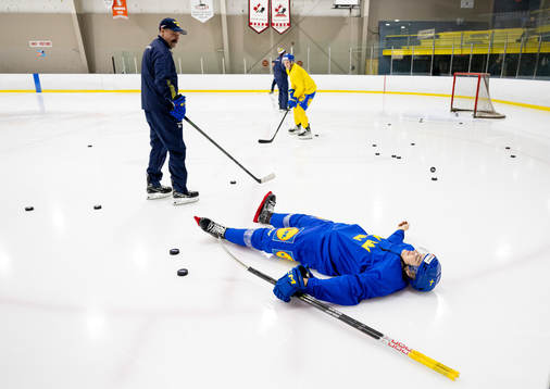 Leo Carlsson of Sweden enters the ice with his blade guards