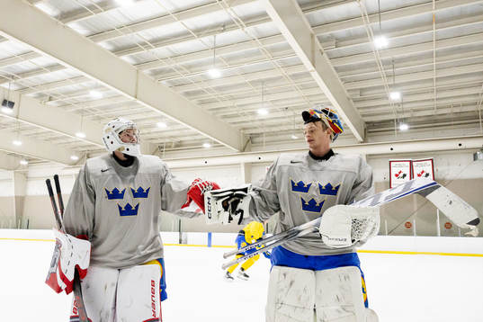 Goaltenders Marcus Brännman and Carl Lindbom of Sweden at