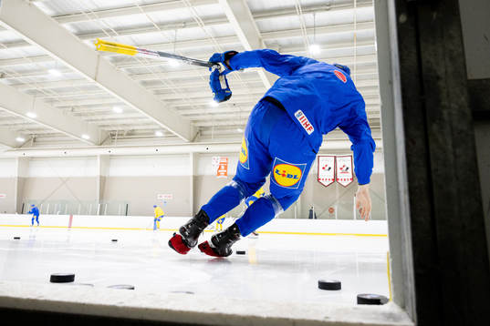 Leo Carlsson of Sweden enters the ice with his blade guards