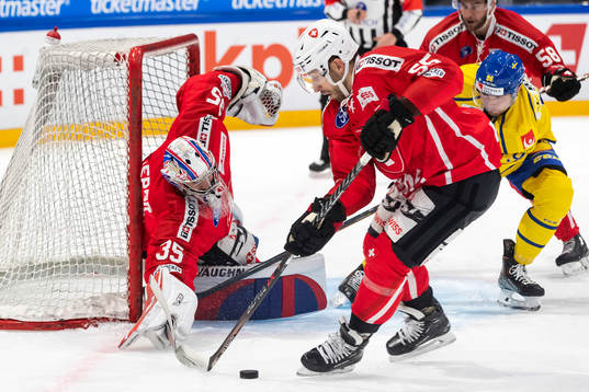 Robin Kovacs of Sweden against goalkeeper Ludovic Waeber,