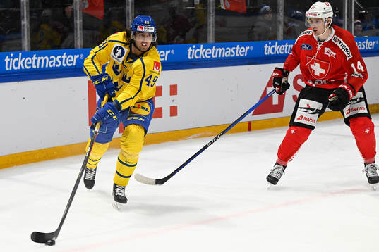 Victor Rask of Sweden and Dean Kukan of Switzerland