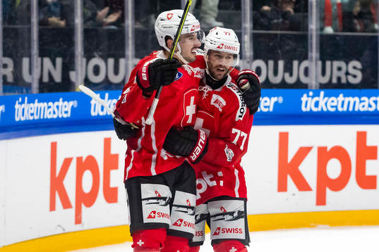 Damien Riat and Jason Fuchs of Switzerland celebrate
