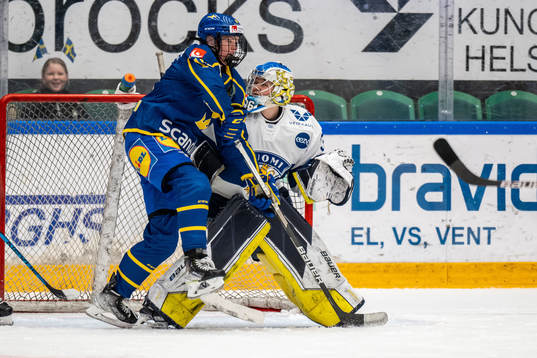 Sara Hjalmarsson of Sweden and goaltenderAnni Keisala of