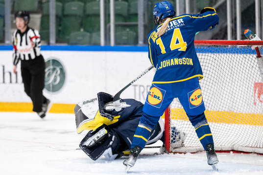 Thea Johansson of Sweden collides with goaltender Anni