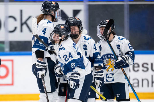 Anni Montonen of Finland celebrates with teammates