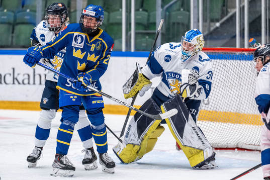 Hanna Olsson of Sweden and goaltender Anni Keisala of