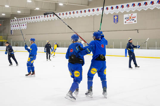 Players of Sweden celebrate at a practice session