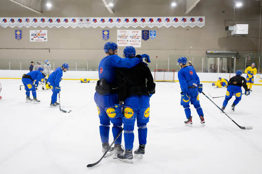 Players of Sweden celebrate at a practice session