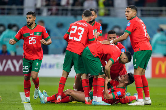 Achraf Dari of Morocco celebrate with teammates