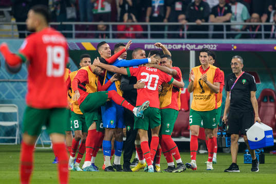 Achraf Dari of Morocco celebrate with teammates