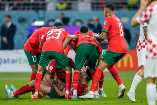 Achraf Dari of Morocco celebrate with teammates
