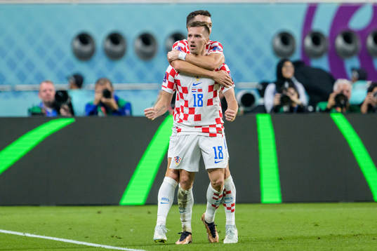 Mislav Orsic and Ivan Perisic of Croatia celebrate