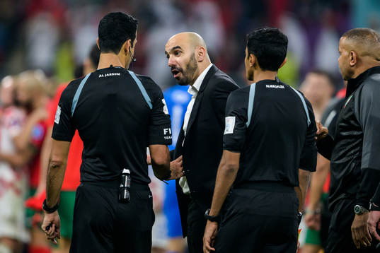 head coach Walid Regragui of Morocco and Referee