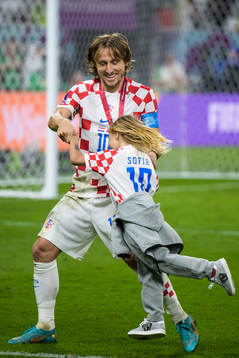 Luka Modric of Croatia swings his daughter