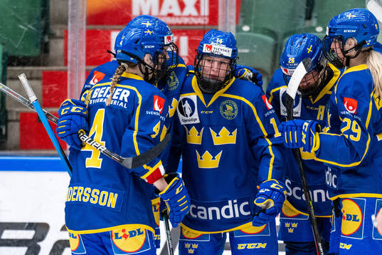 Thea Johansson of Sweden celebrates with teammates