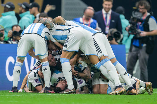Lionel Messi of Argentina celebrate with teammates