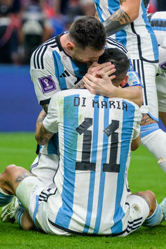 Angel de Maria and Lionel Messi of Argentina celebrate