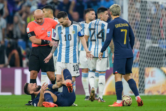 Olivier Giroud of France and Lionel Messi of Argentina