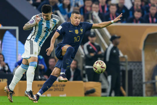 Enzo Fernandez of Argentina and Kylian Mbappe of France