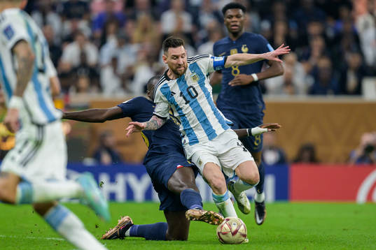 Dayot Upamecano of France and Lionel Messi of Argentina
