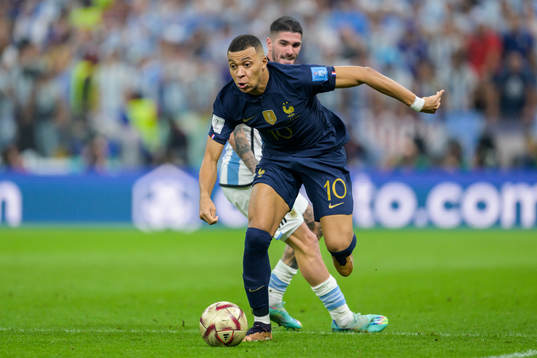 Kylian Mbappe of France and Rodrigo de Paul of Argentina