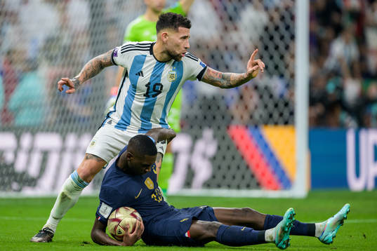 Nicolas Otamendi of Argentina and Randal Kolo Muani of