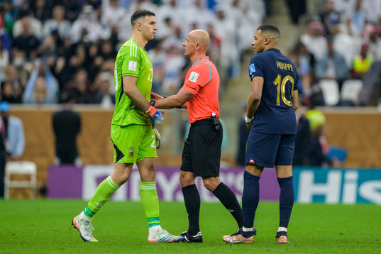 goalkeeper Emiliano Martinez of Argentina and Kylian Mbappe