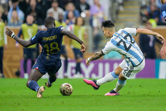 Dayot Upamecano of France and Lautaro Martinez of Argentina