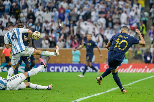 Kylian Mbappe of France shoots