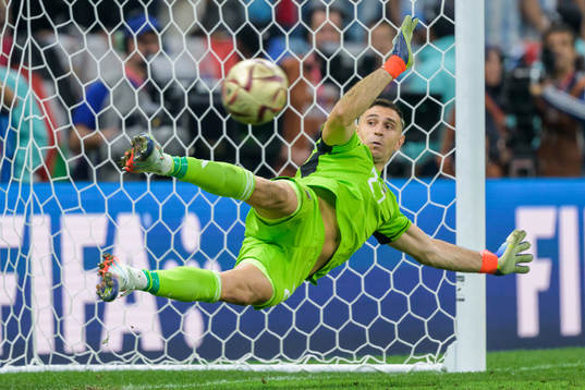 goalkeeper Emiliano Martinez of Argentina as Kylian Mbappe